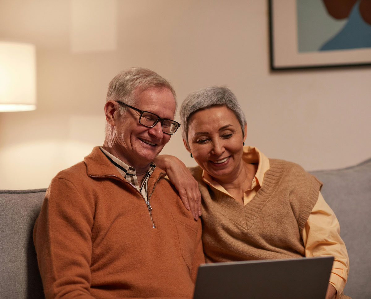 Older couple using laptop together